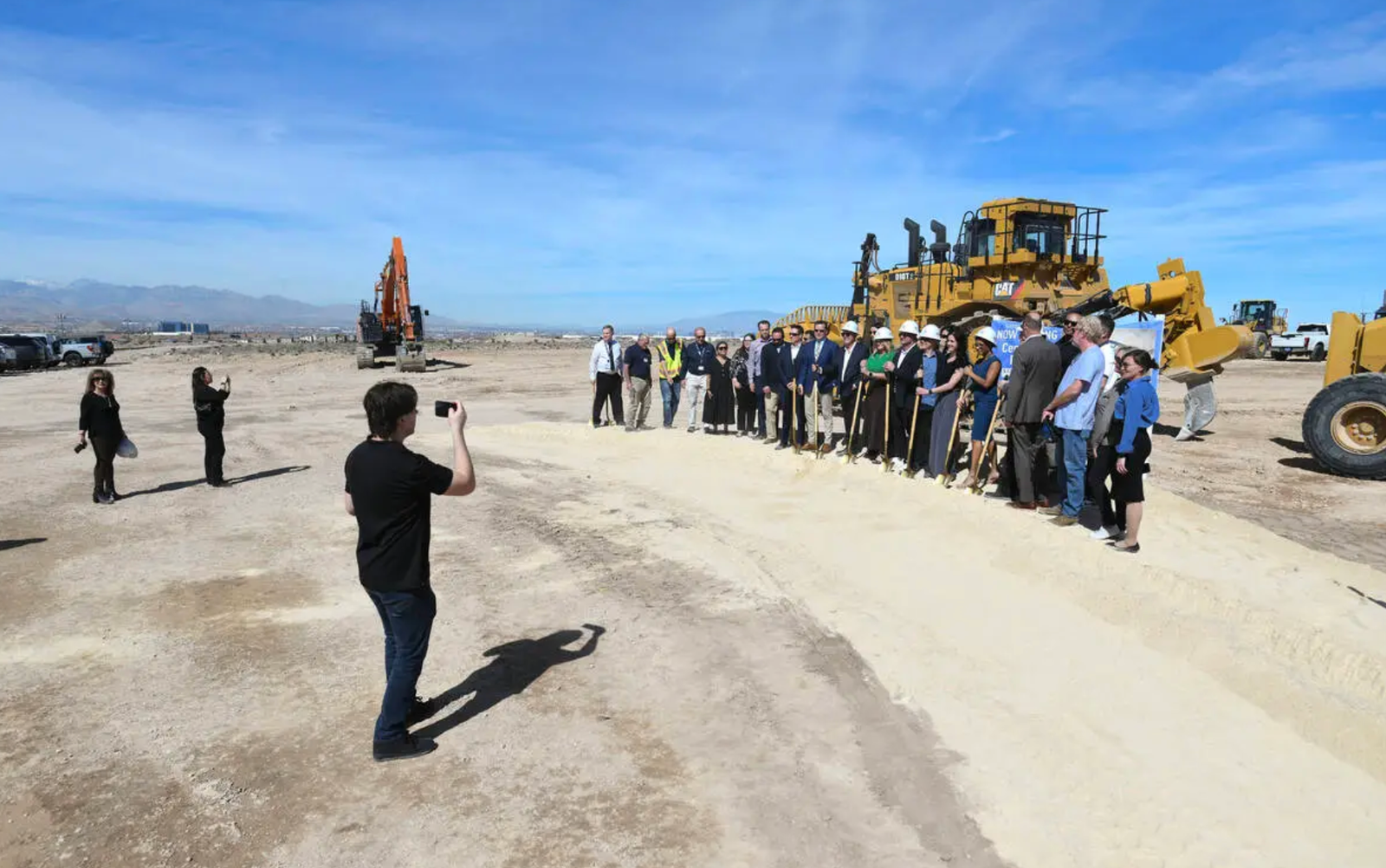 Developers and Henderson officials at Centurion at Inspirada groundbreaking with construction equipment on site
