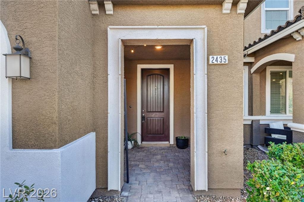 Front door and covered entry at 2435 Bellinzona Place