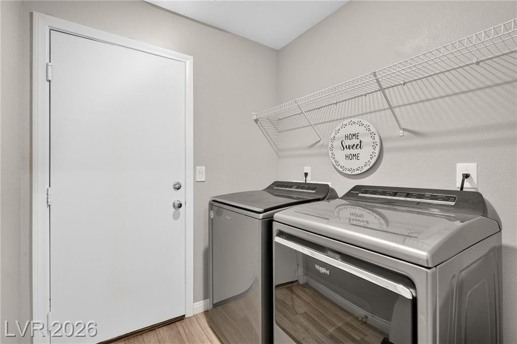 Laundry room with washer and dryer included