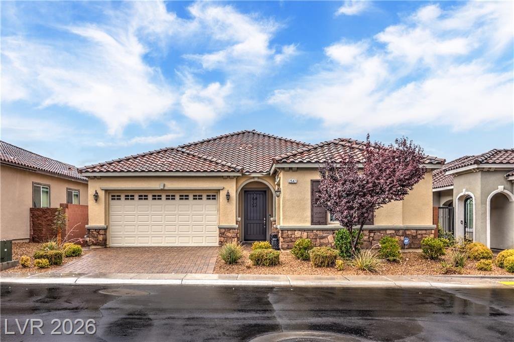 Front exterior of 2547 Ballatore Street, a single-story Toll Brothers home in Inspirada