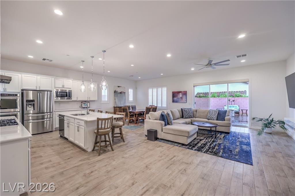 Open-concept great room and kitchen at 2547 Ballatore Street