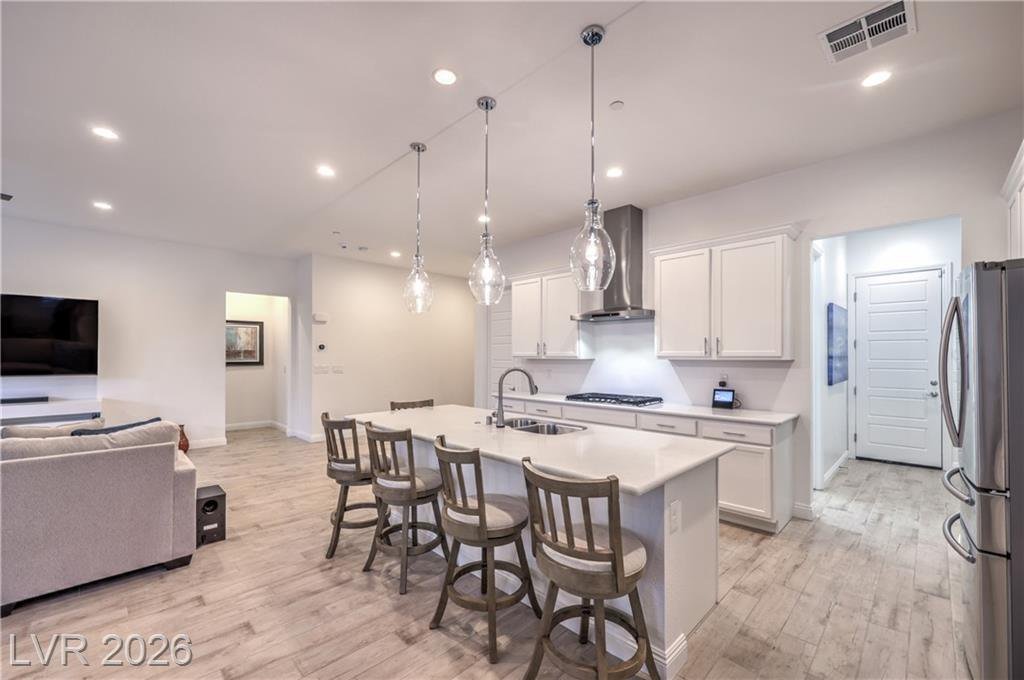 Gourmet island kitchen with quartz countertops and pendant lighting