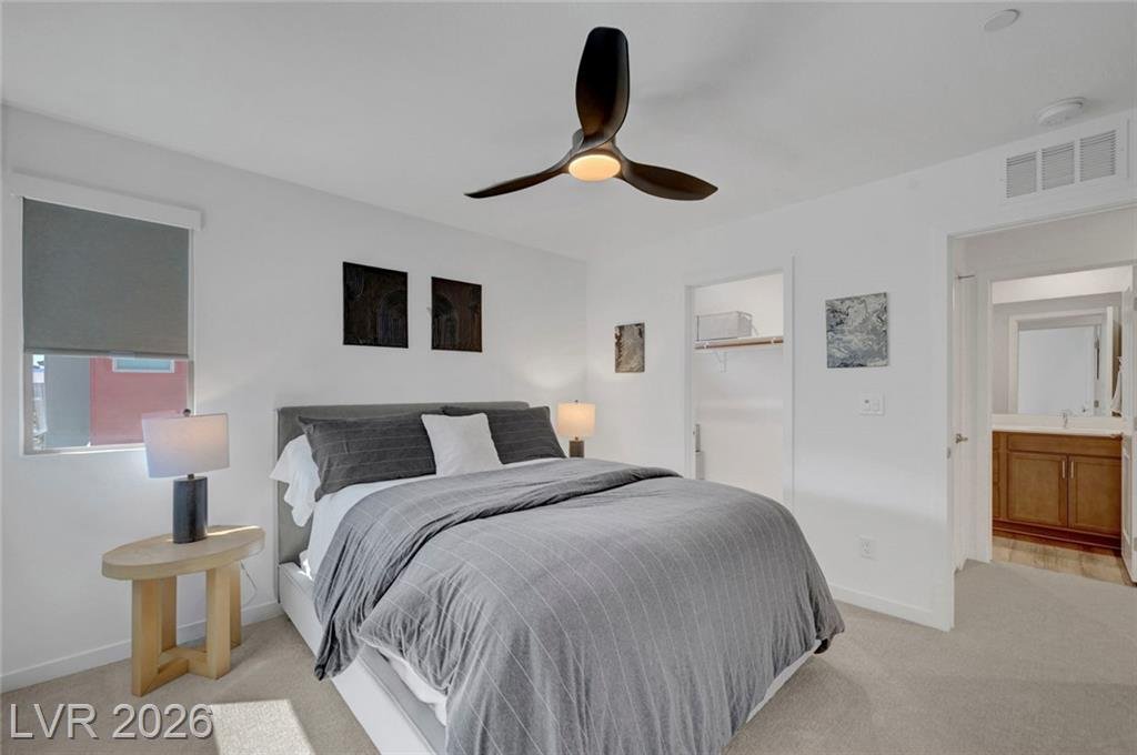 Third bedroom with corner windows and walk-in closet