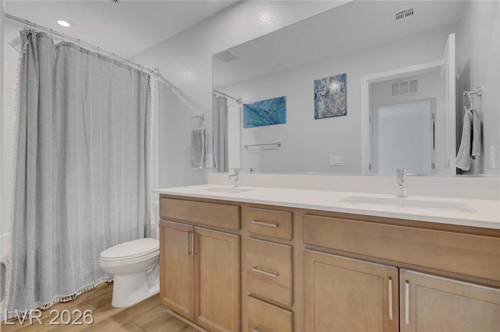 Shared secondary bathroom with linen storage