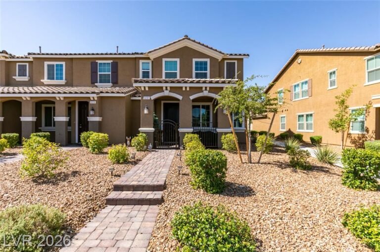 Front exterior of 3231 Pergusa Drive, an end-unit townhome in Inspirada, Henderson NV