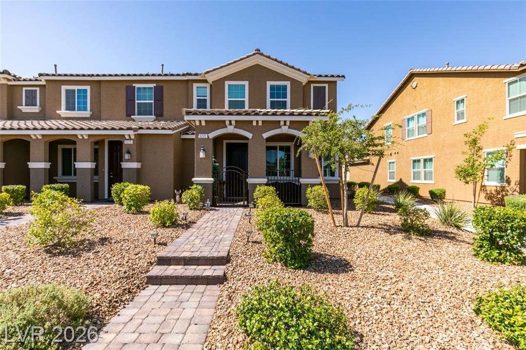 Front exterior of 3231 Pergusa Drive, an end-unit townhome in Inspirada, Henderson NV