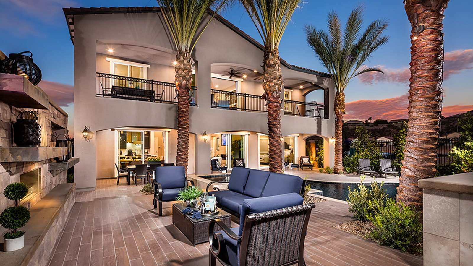 Backyard, pool and covered loggia of an Avenida model home at Carmona by Toll Brothers in Inspirada, Henderson NV