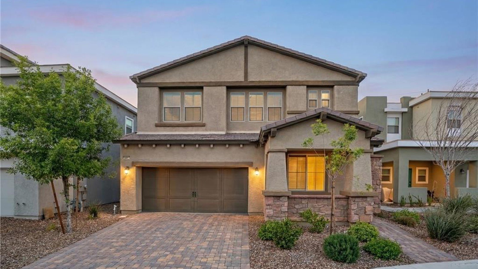 Front exterior at dusk of 2462 Sylvan Hymn Street, Inspirada, Henderson NV