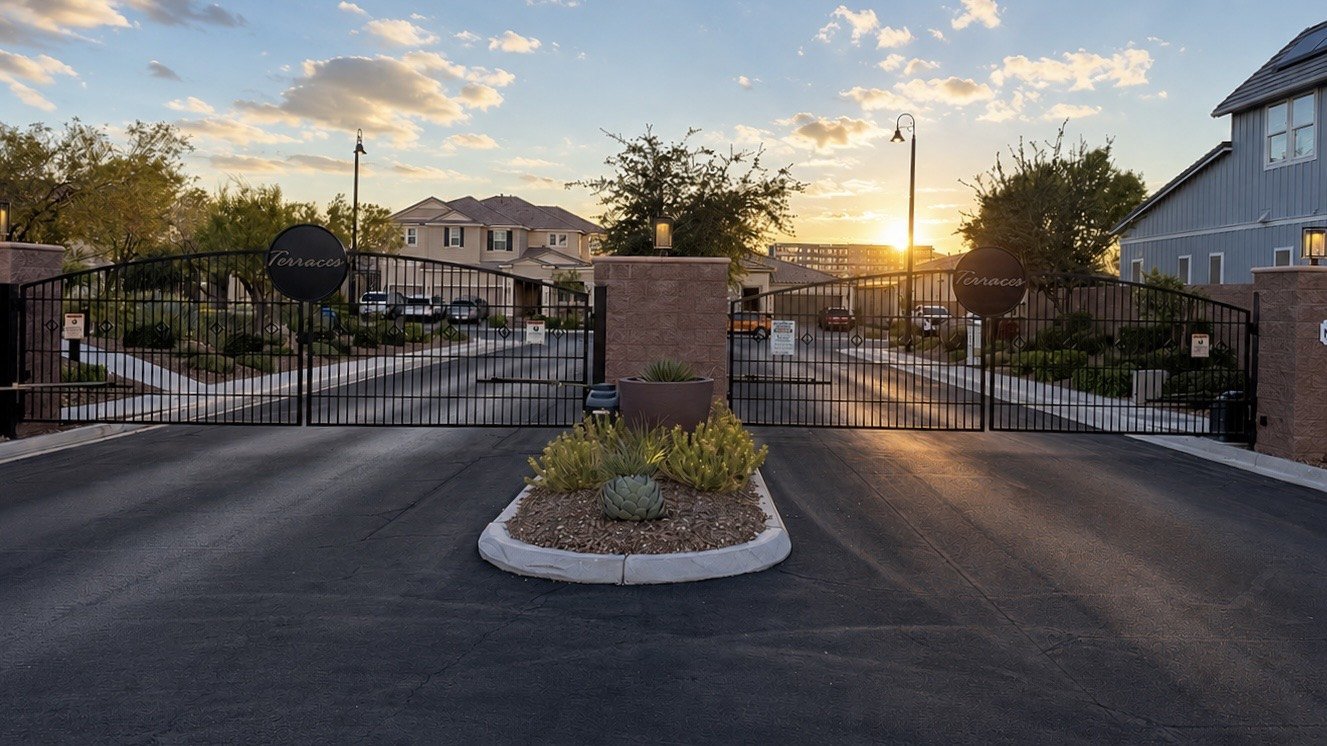 The gated entrance to Terraces by KB Home at sunrise in Inspirada, Henderson NV