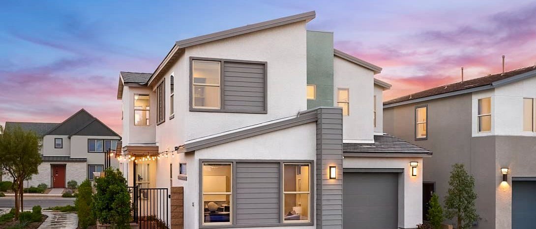 Vela Plan 3 model home at twilight, built by Tri Pointe Homes at Inspirada in Henderson NV