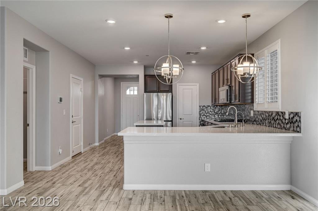 Quartz peninsula with seating and a view through to the front door