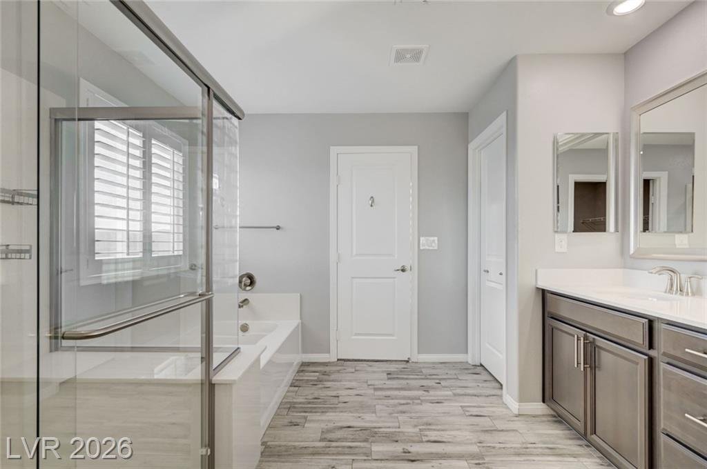 Frameless shower glass and tub deck in the second primary bath