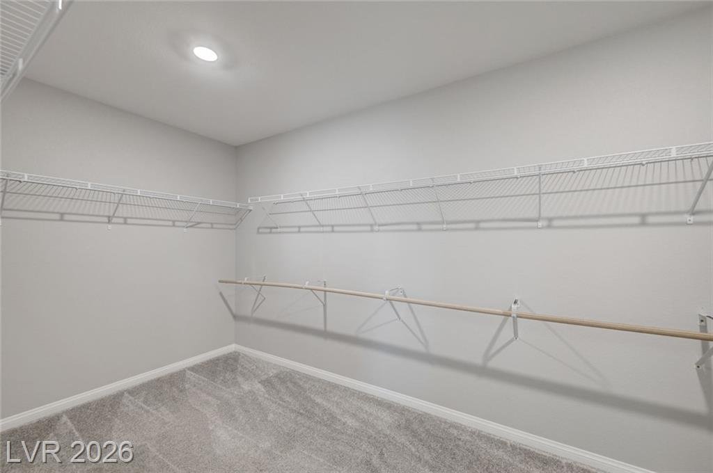 Oversized walk-in closet in the upstairs primary suite at 2587 Tolmezzo Street