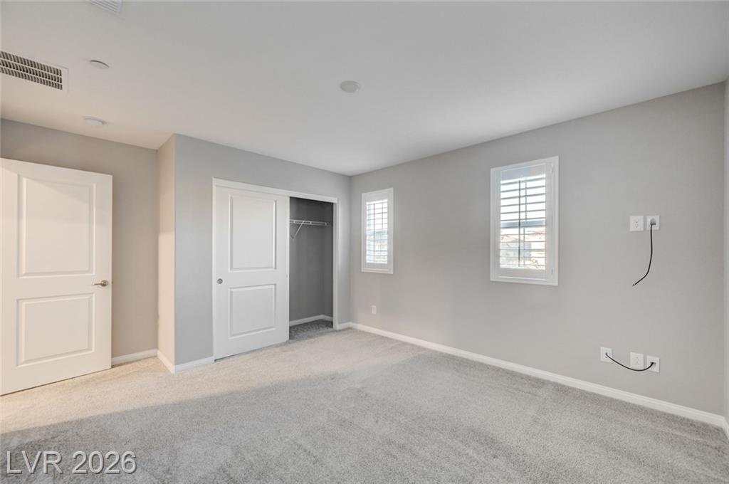 Secondary bedroom at 2587 Tolmezzo Street with a reach-in closet
