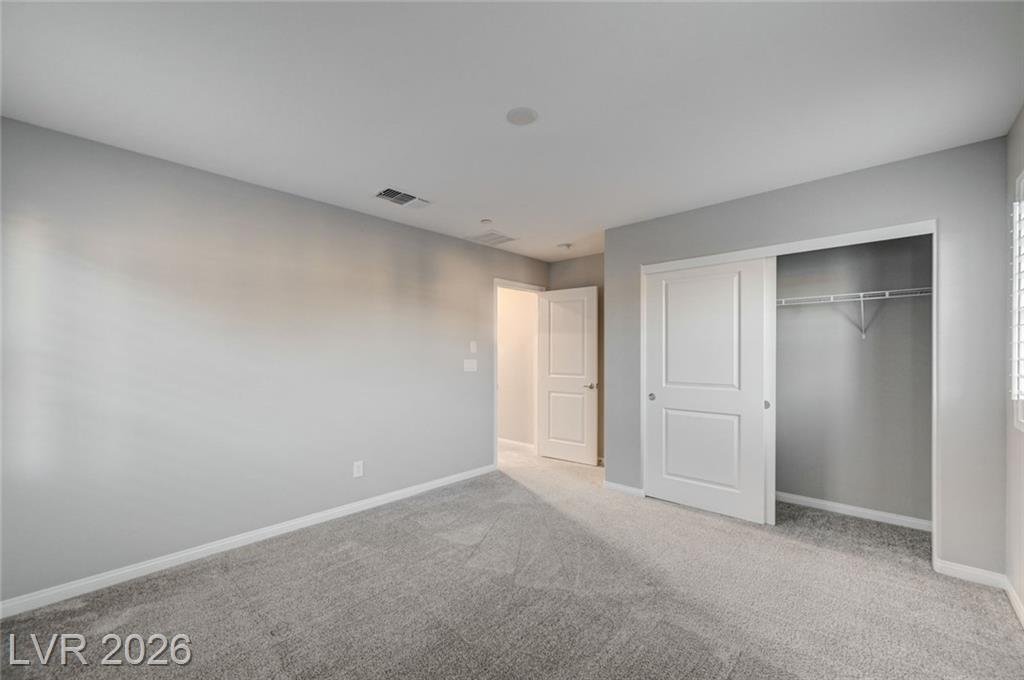 Bedroom two at 2587 Tolmezzo Street with sliding closet doors