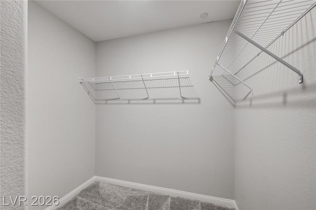 Walk-in closet with wire shelving off the third bedroom at 2587 Tolmezzo Street