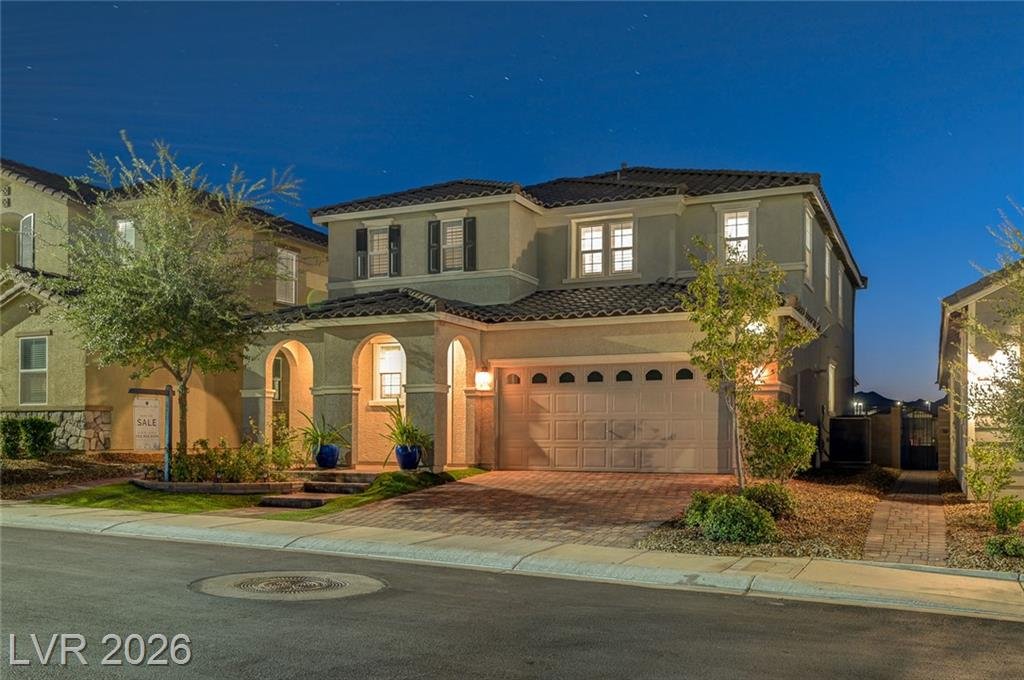 Street view of 2587 Tolmezzo Street at twilight on a gently curving street