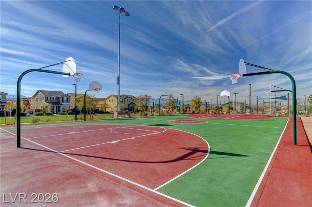 Outdoor basketball court with red and green surfacing