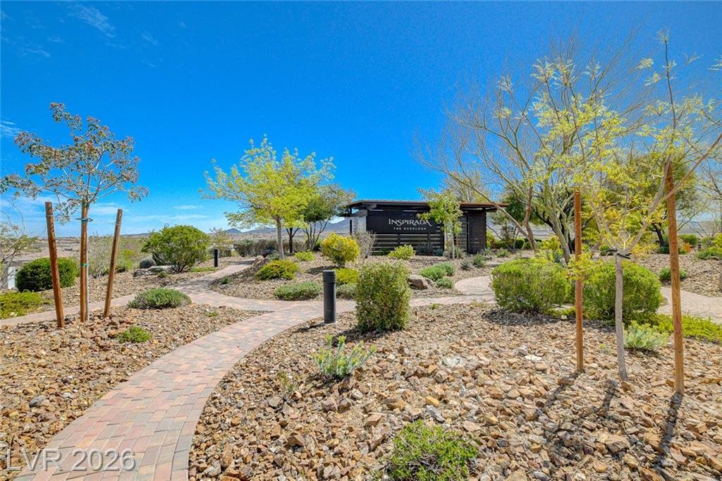 Winding paver path through desert gardens at The Overlook