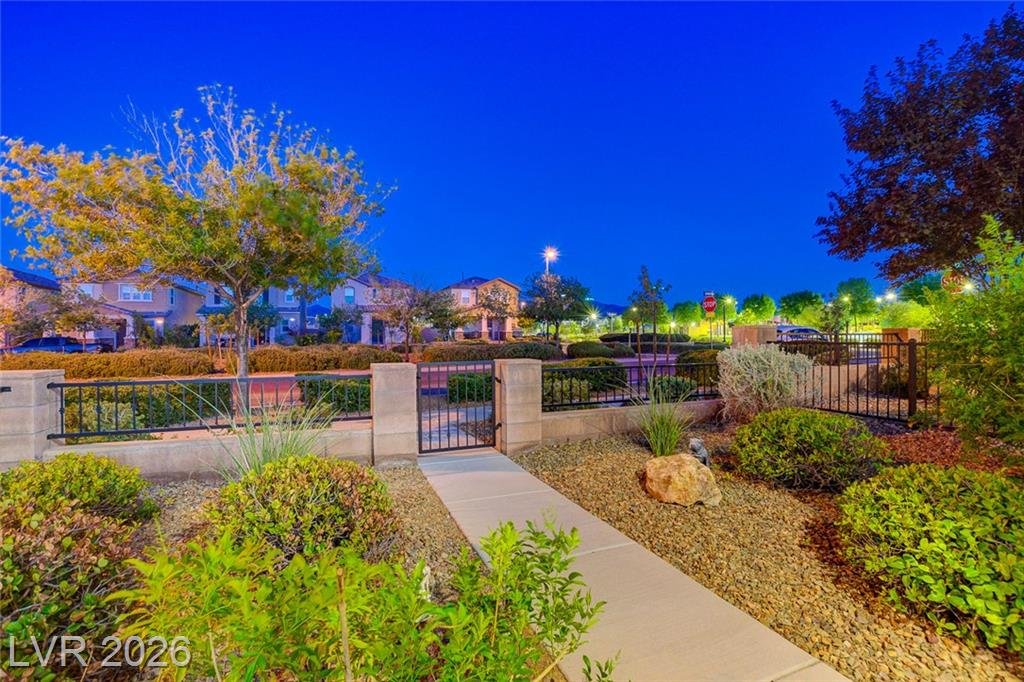 Neighborhood park entrance lit up at twilight