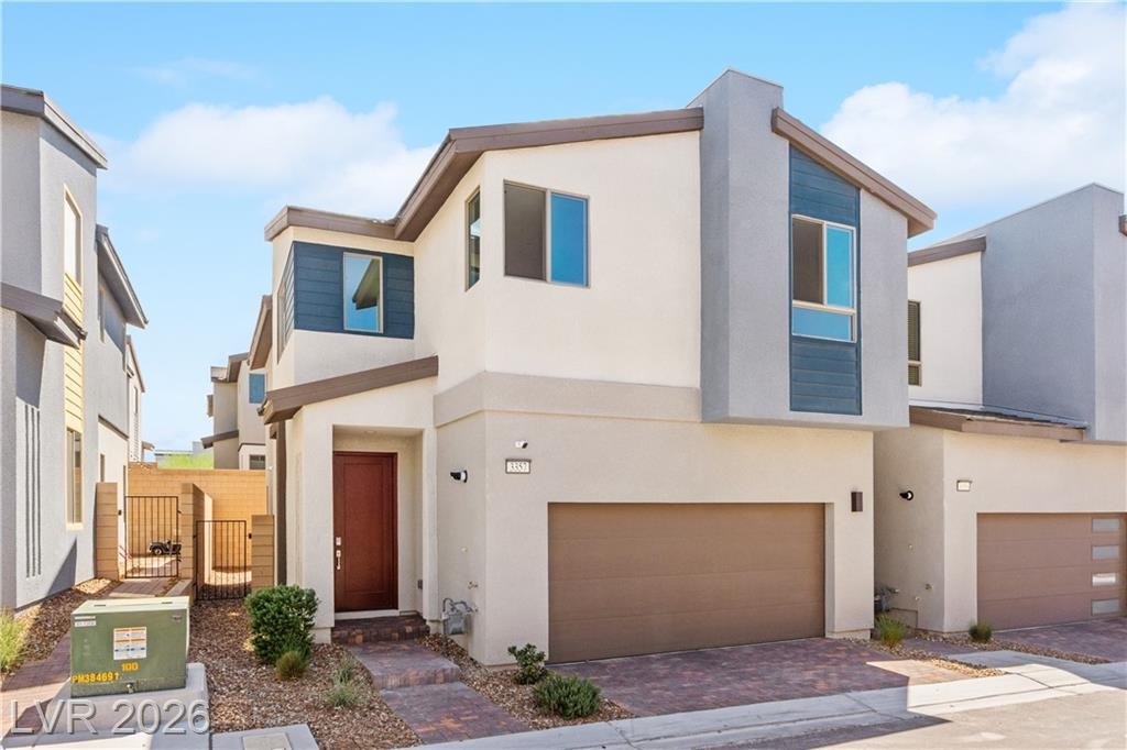 Front exterior of this two-story end-unit townhome at 3357 Santa Verdiana Street in Inspirada