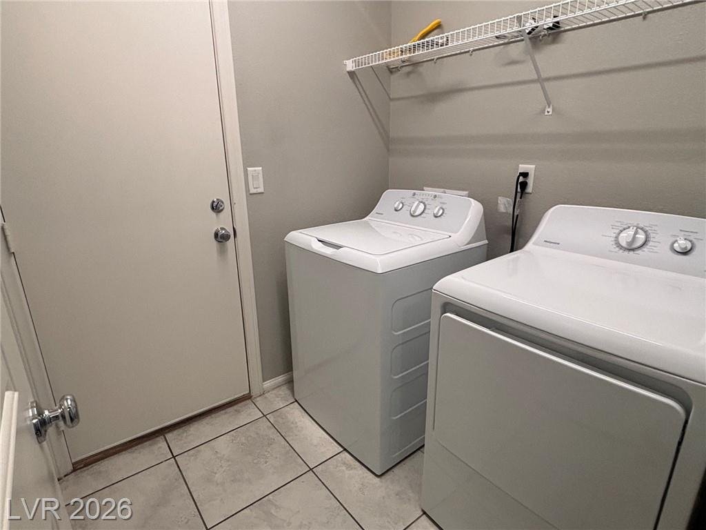 First-floor laundry room at 2850 Alenga Street with washer and dryer included
