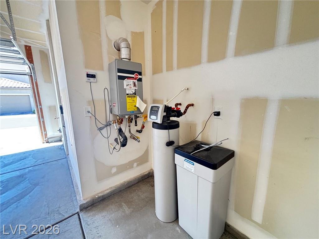 Tankless water heater and water softener on the garage utility wall