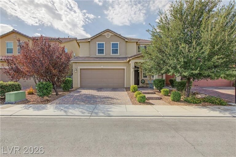 Front exterior of 3171 Biccari Avenue with desert landscaping and a two-car garage