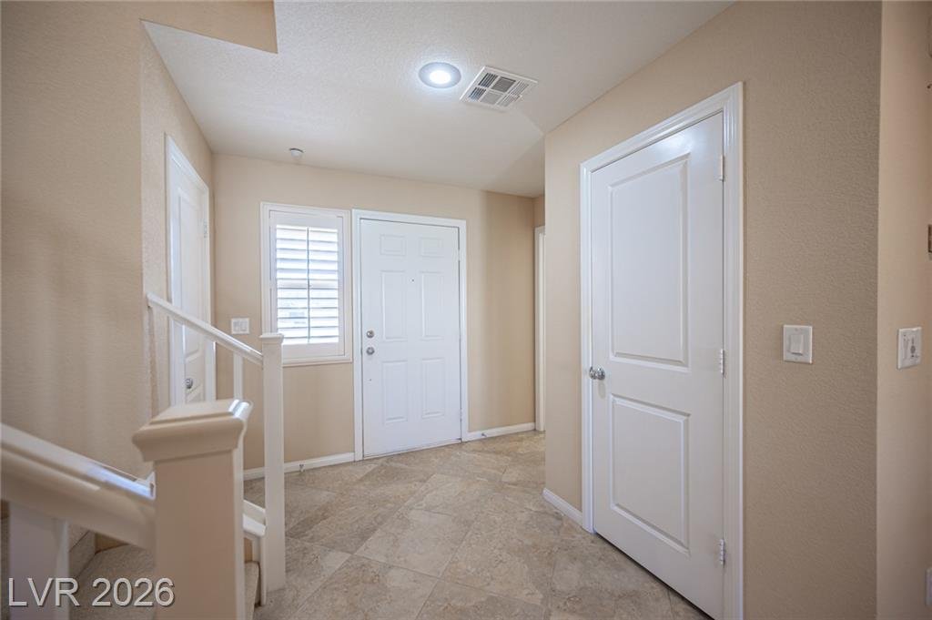 Entry foyer with the staircase and front door