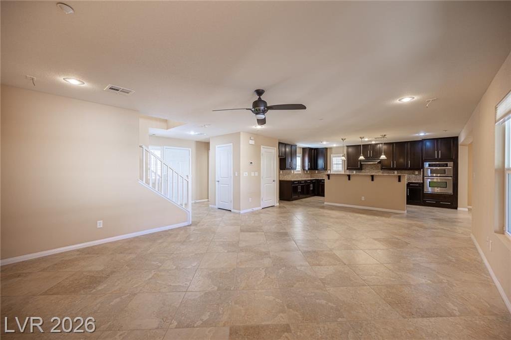 Great room and kitchen at 3198 Sisley Garden Avenue from the living area