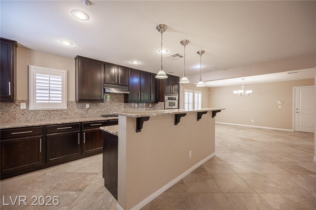 Kitchen breakfast bar with pendant lights