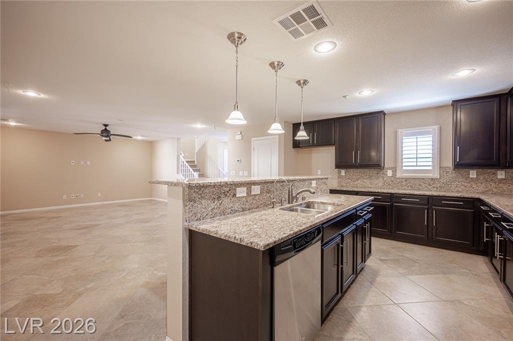 Island with an undermount sink facing the great room