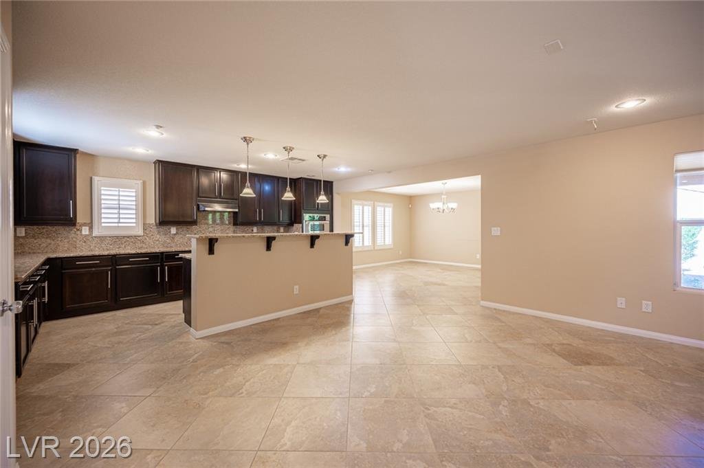 Kitchen and dining room under recessed lighting