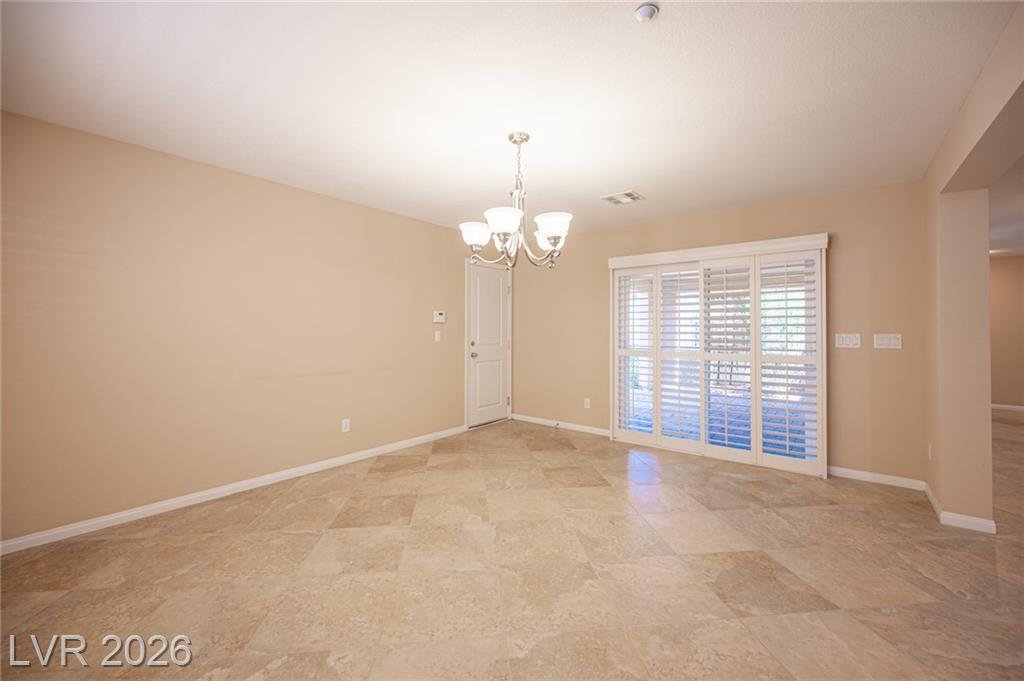 Dining room at 3198 Sisley Garden Avenue with sliding doors to the courtyard
