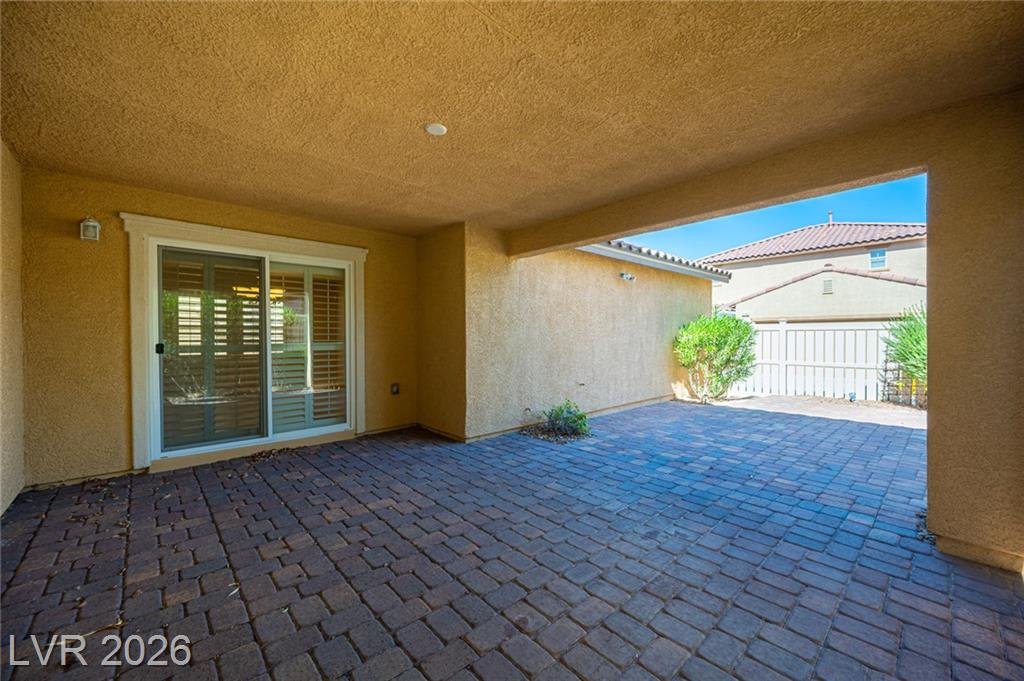 Covered patio and paver courtyard at 3198 Sisley Garden Avenue