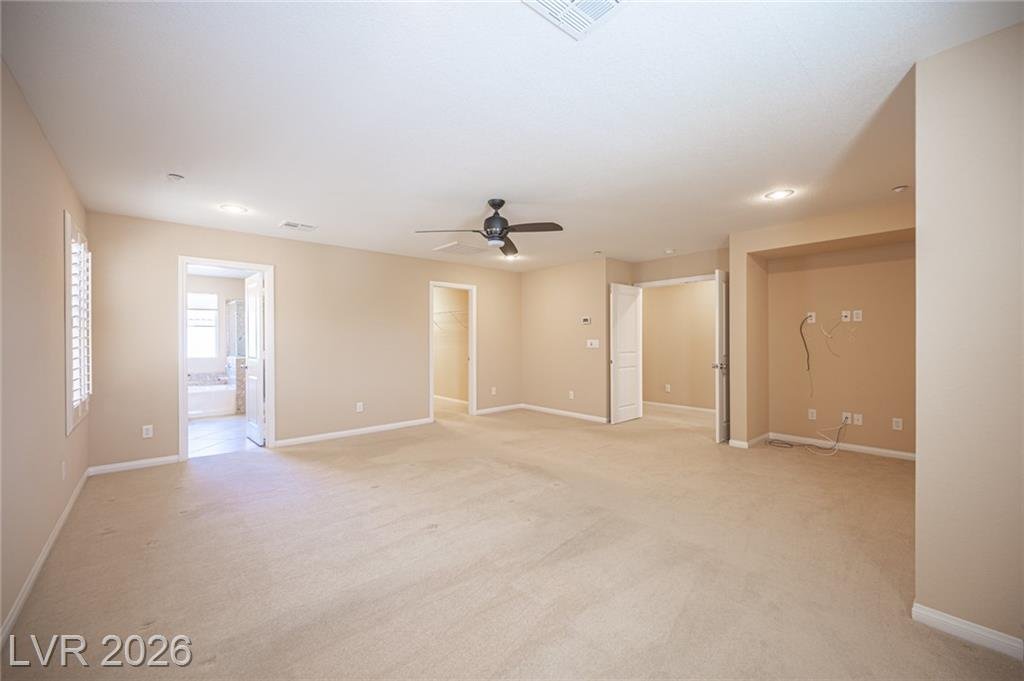 Primary bedroom with a recessed wall niche