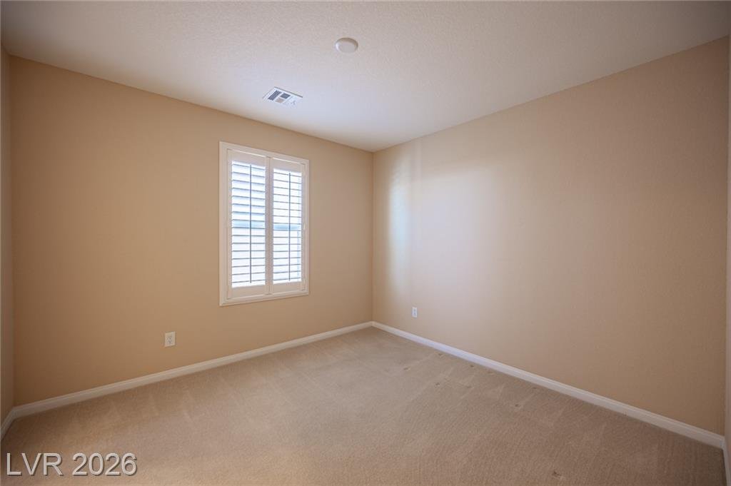 Bedroom at 3198 Sisley Garden Avenue with a shuttered window