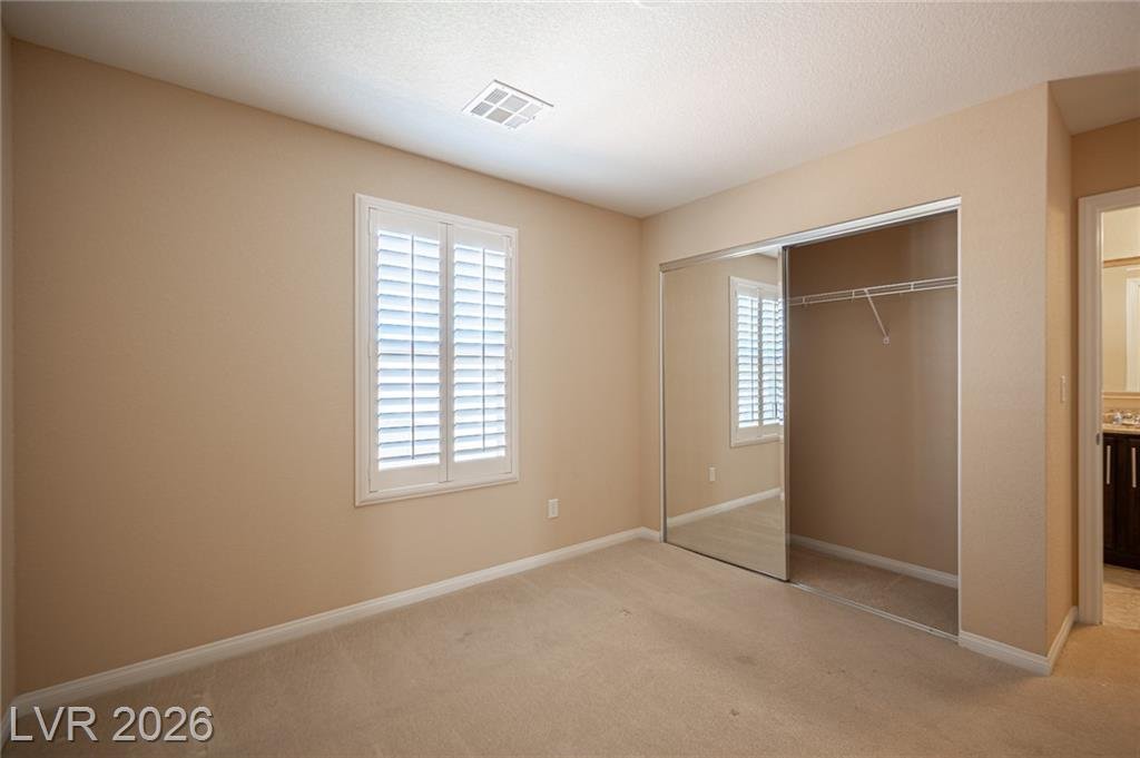 Bedroom with a sliding mirrored closet
