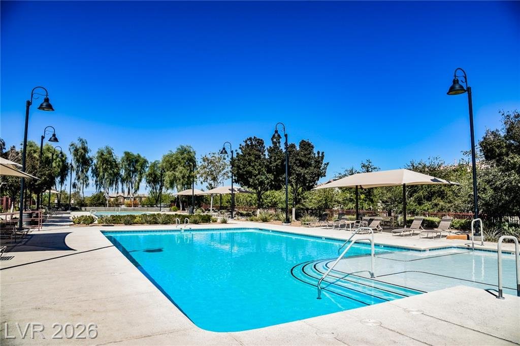 Inspirada community pool with shade umbrellas