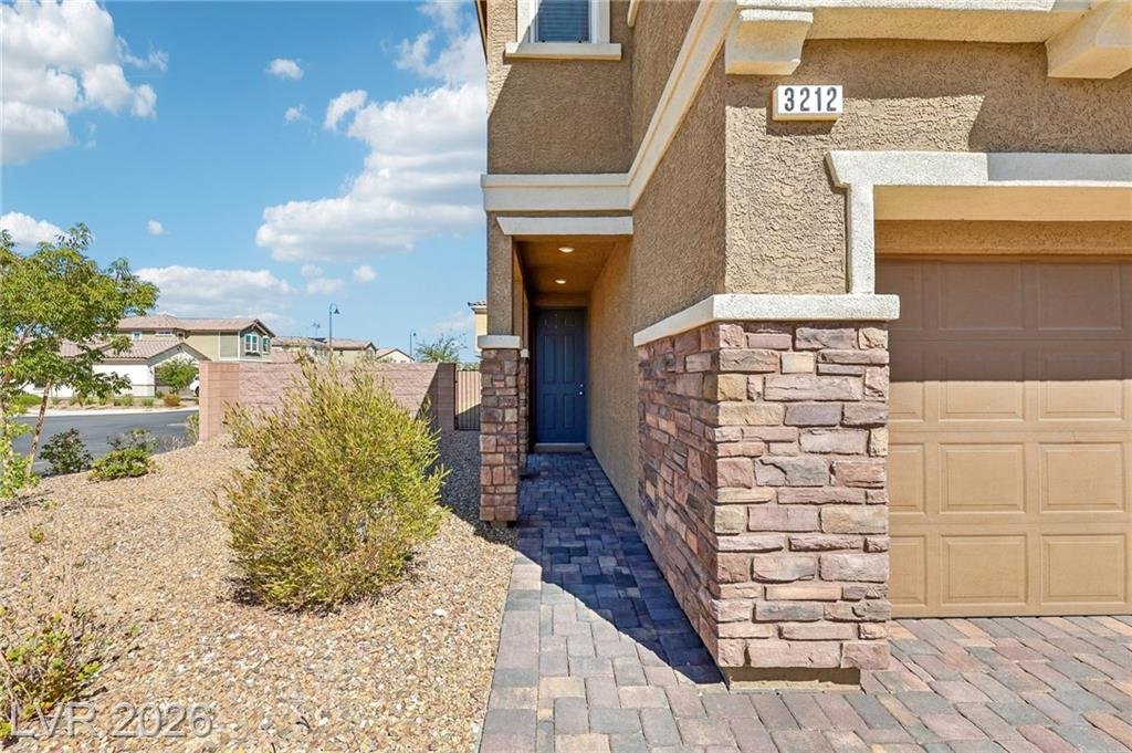 Entry walkway with stacked stone accents at 3212 Segesta Avenue