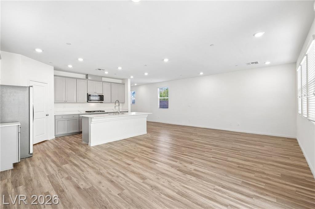 White kitchen island seen from the great room