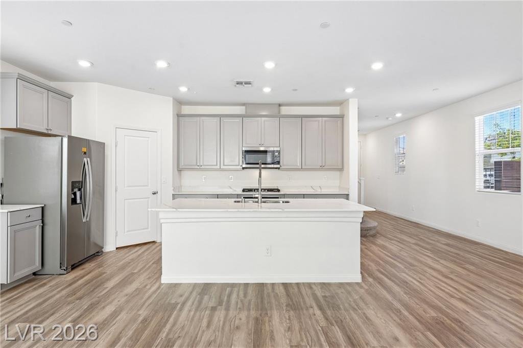 Stand-alone kitchen island with quartz countertops