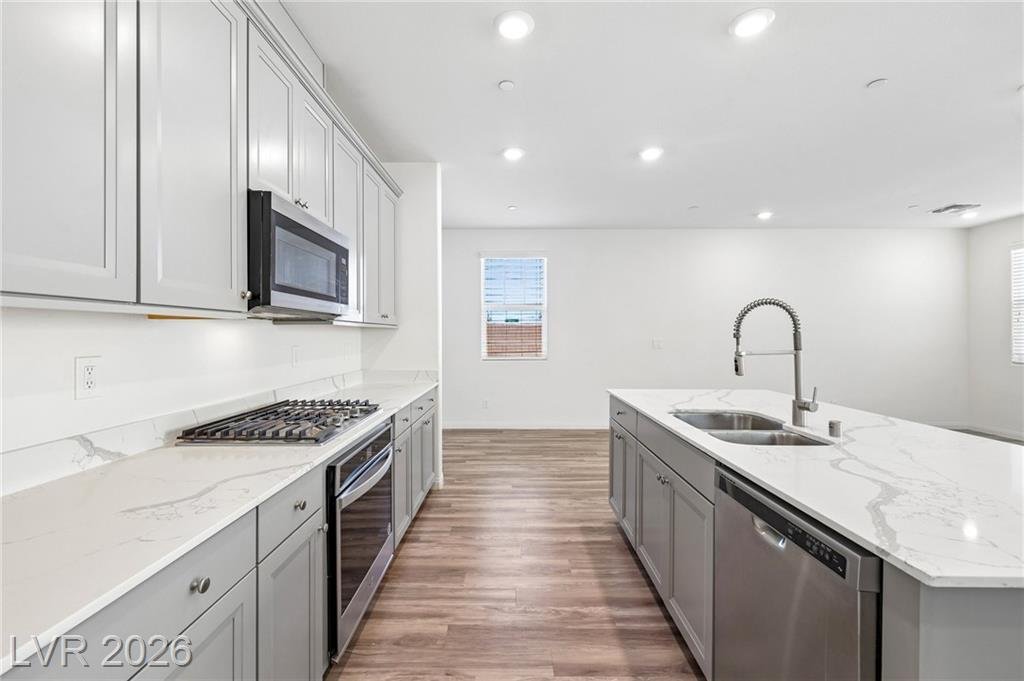 Island sink, dishwasher and quartz counters at 3212 Segesta Avenue