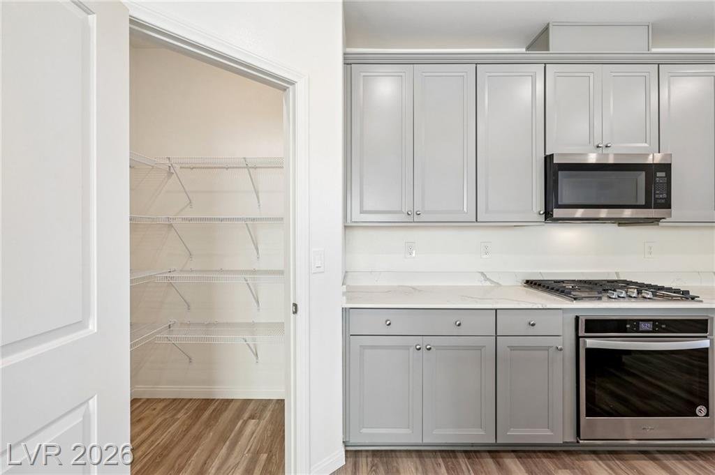 Walk-in pantry with wire shelving off the kitchen