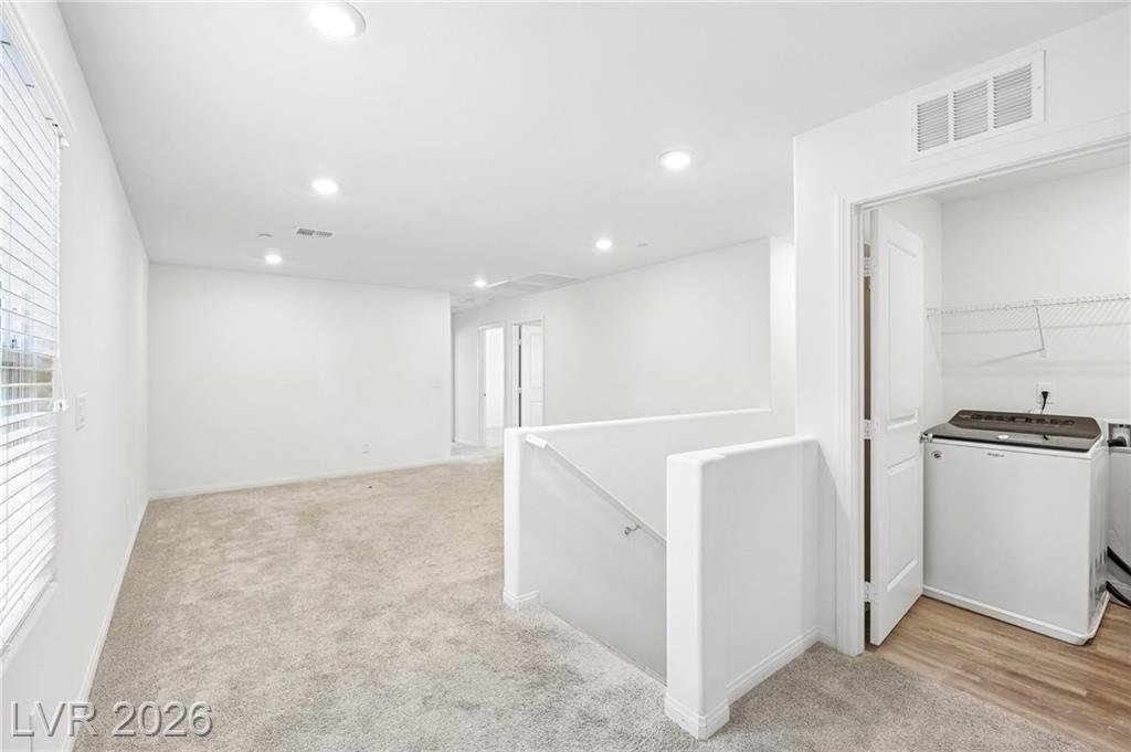Upstairs hallway leading to the laundry room