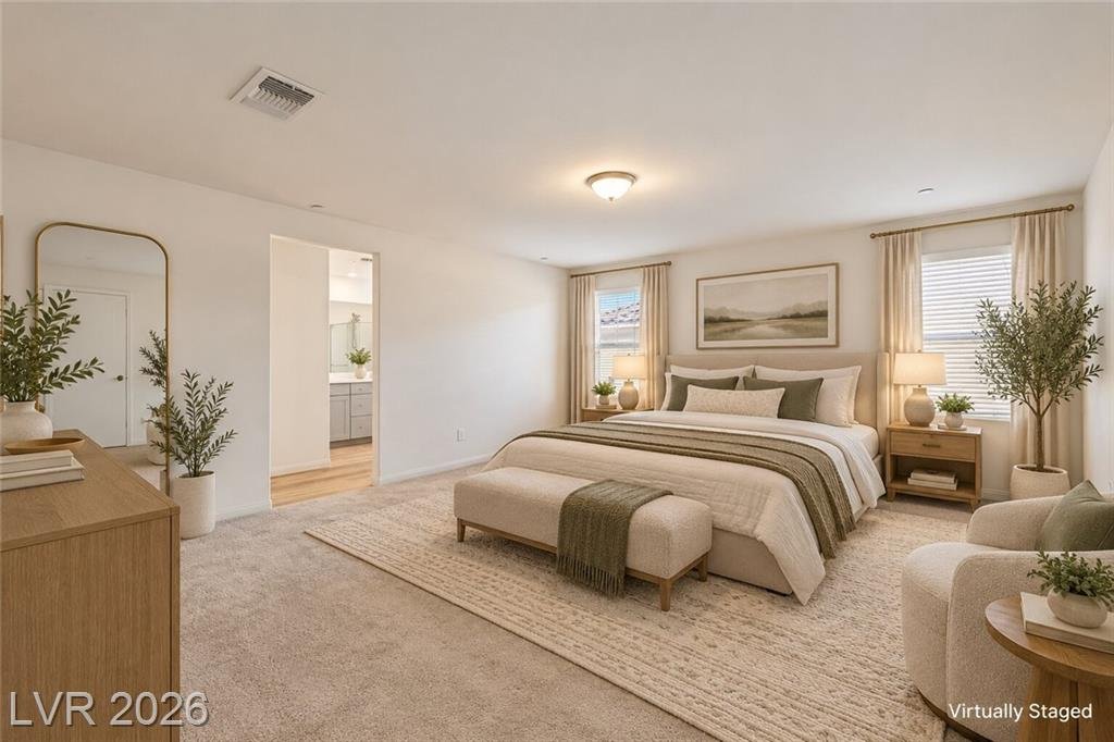 Primary bedroom with space for a sitting area, virtually staged