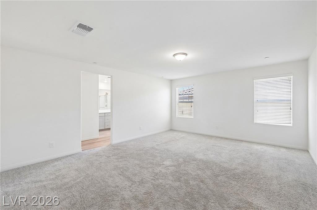 Vacant primary bedroom with two windows at 3212 Segesta Avenue