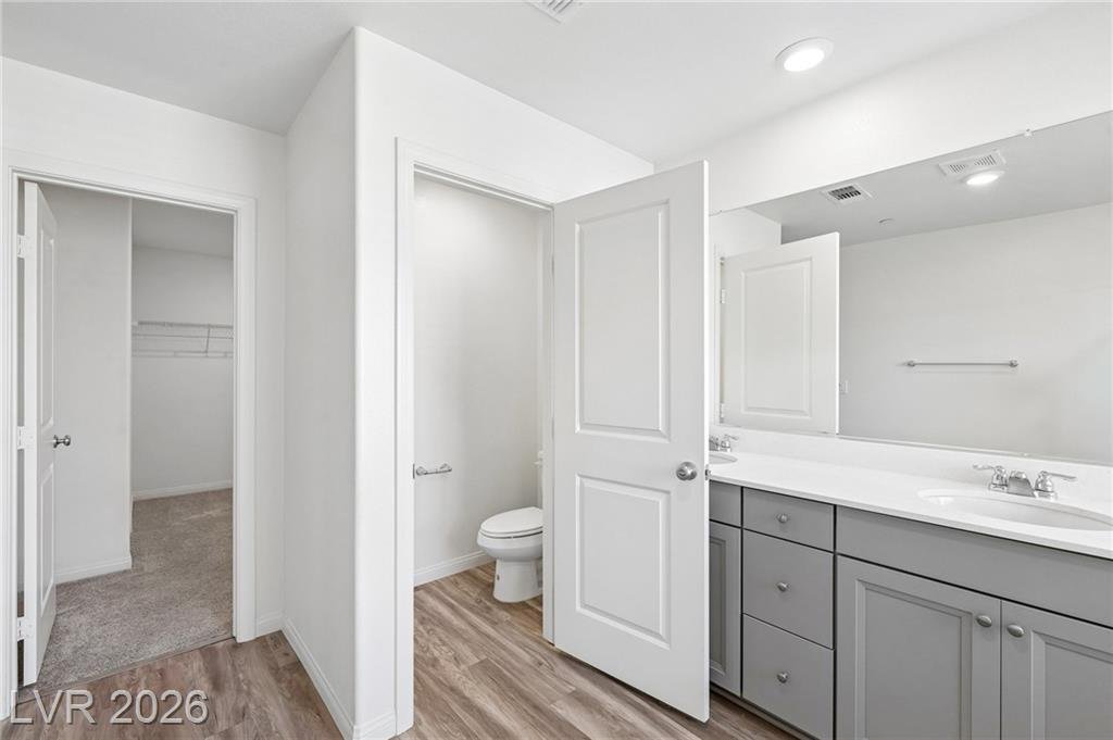 Primary bath separate water closet and walk-in closet entry