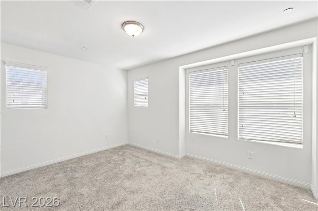 Front bedroom, the largest secondary bedroom, with two windows