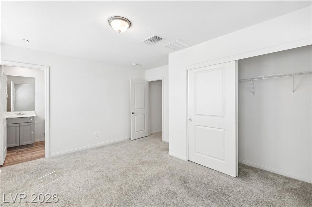 Front bedroom with a view into its en suite bath at 3212 Segesta Avenue